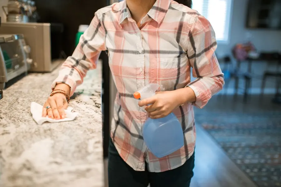 Wiping down a kitchen counter